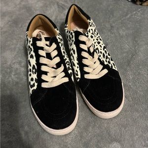 White raven. Women’s size 8.5 white and black leopard sneakers
